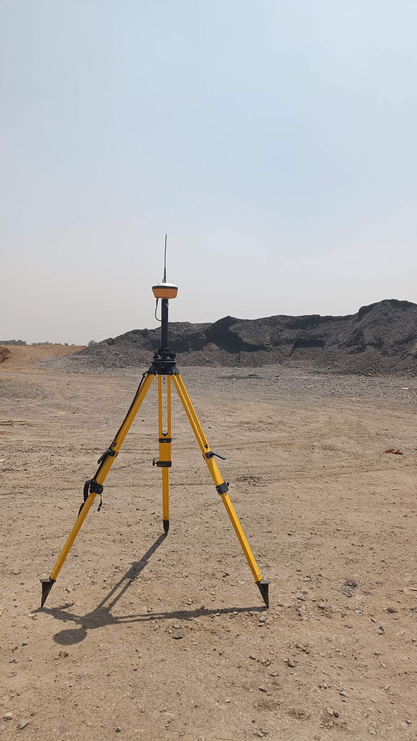 DGPS base station setup on site providing correction data for stockpile survey