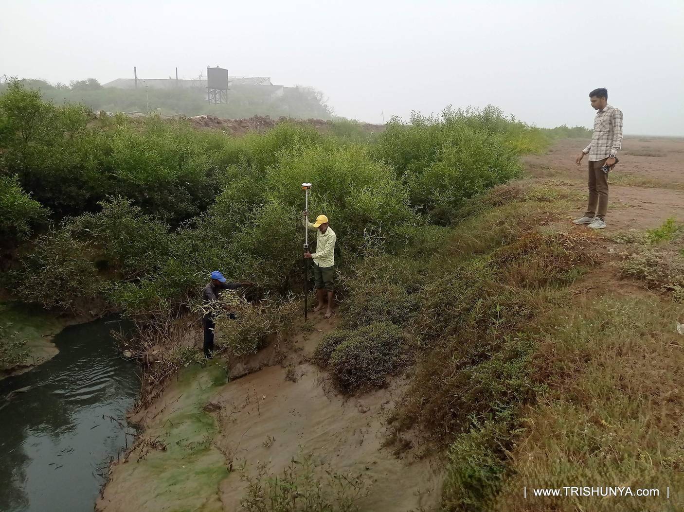 DGPS device being used for topographic survey work near a canal